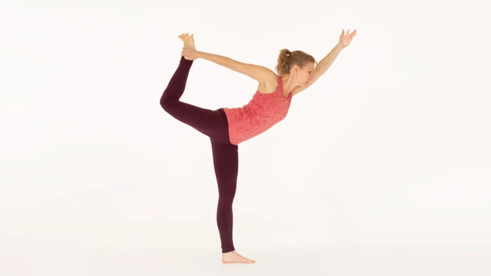 Attractive Woman Doing Standing Bow Yoga Pose Stock Photo, Picture and  Royalty Free Image. Image 75169205.